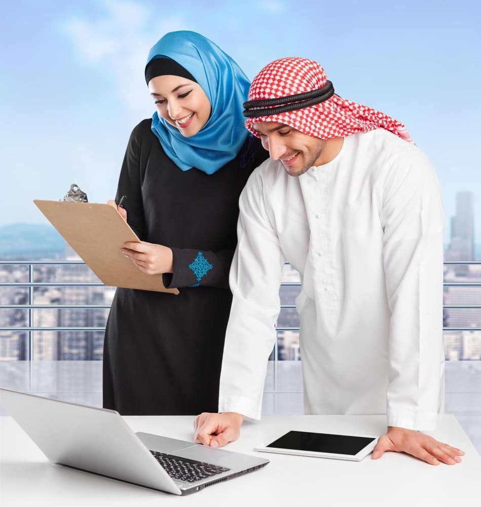 Portrait of arab couple with laptop on background